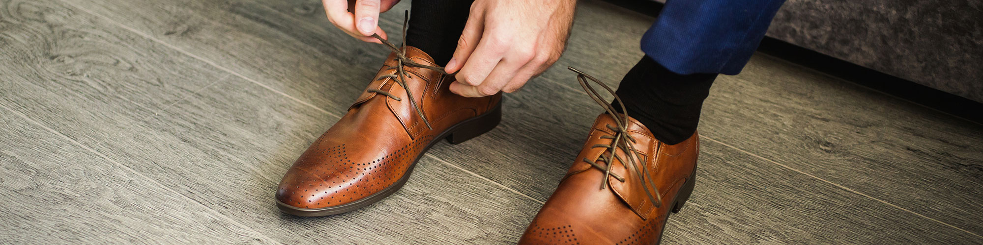 Man Tying His Formal Shoes